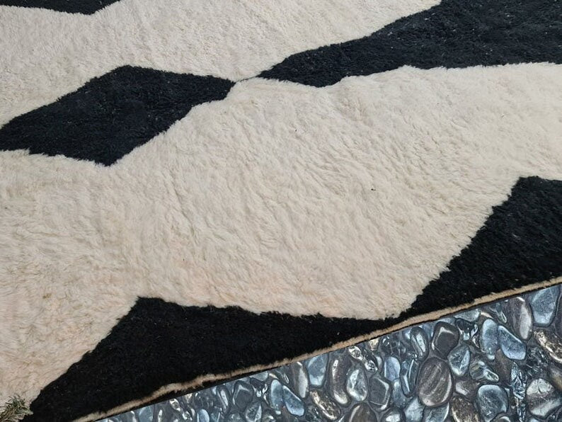 black and white patterned area rug on floor