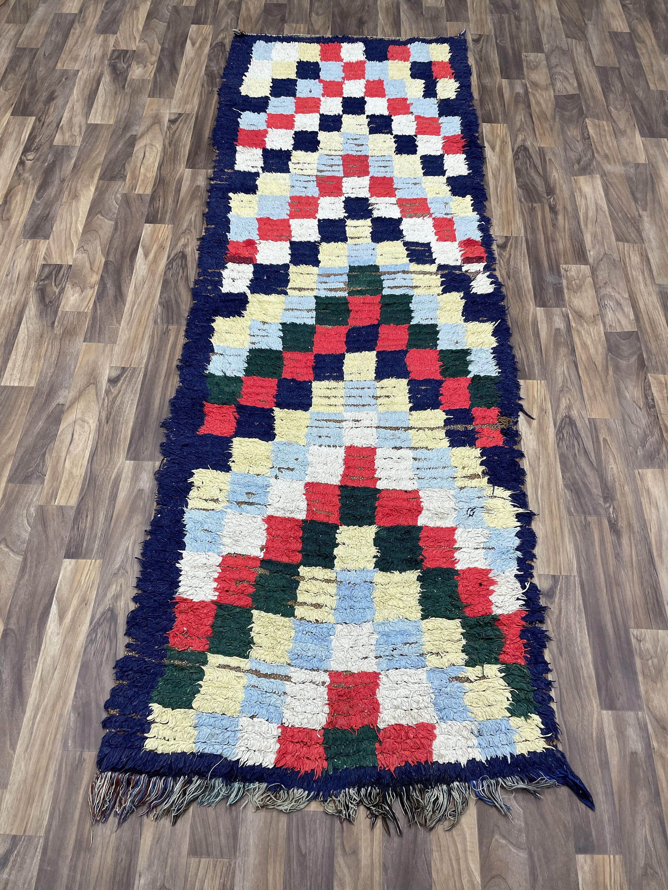 Colorful patterned area rug with fringe, perfect for enhancing home décor and style.