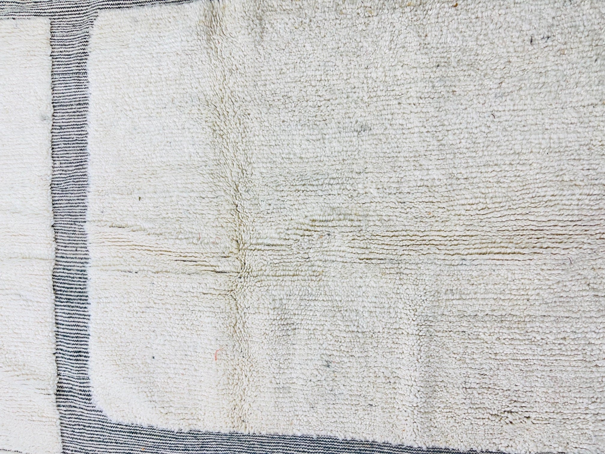 textured cream rug with gray striped pattern