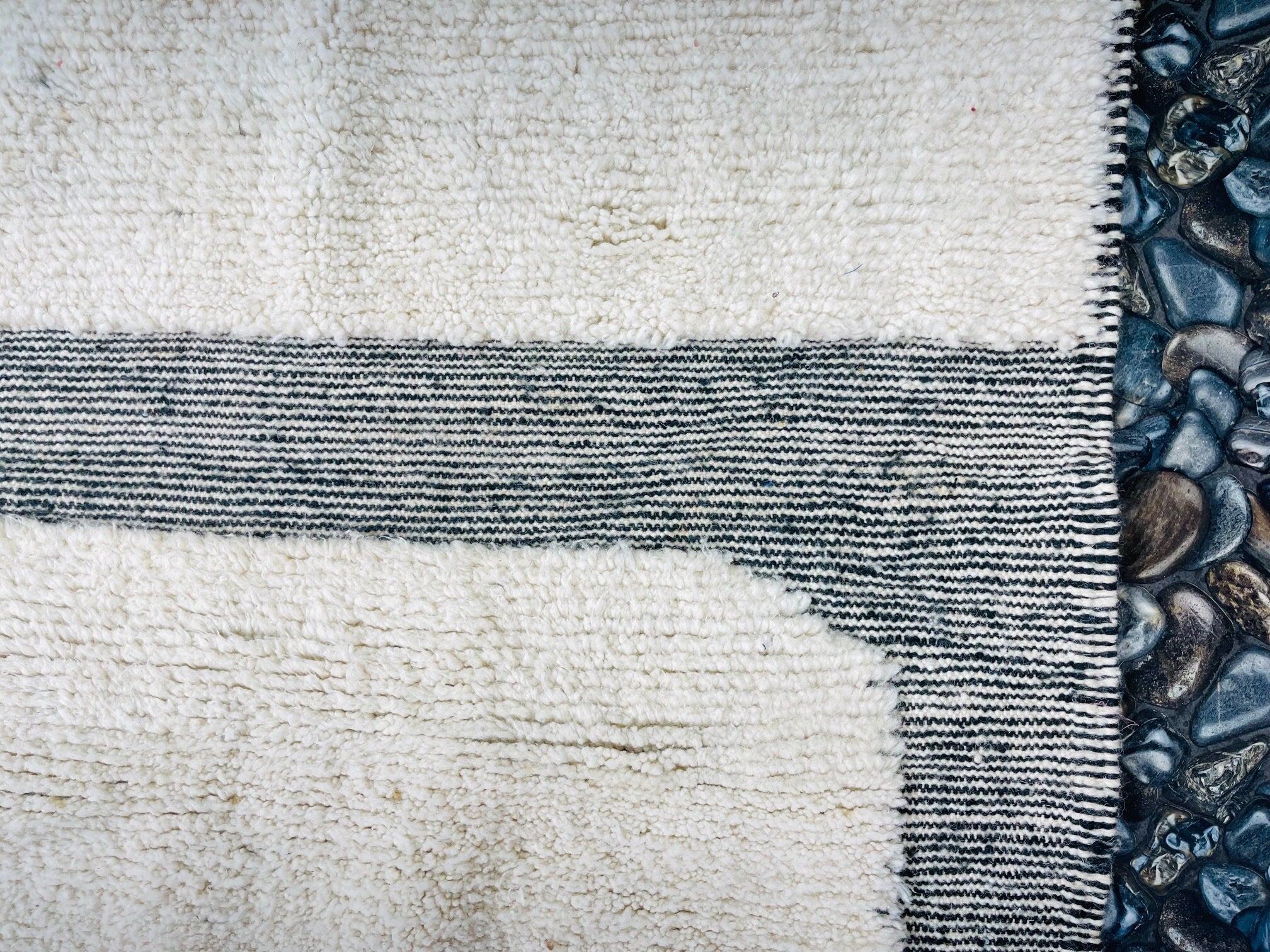 striped towel on textured stone surface background