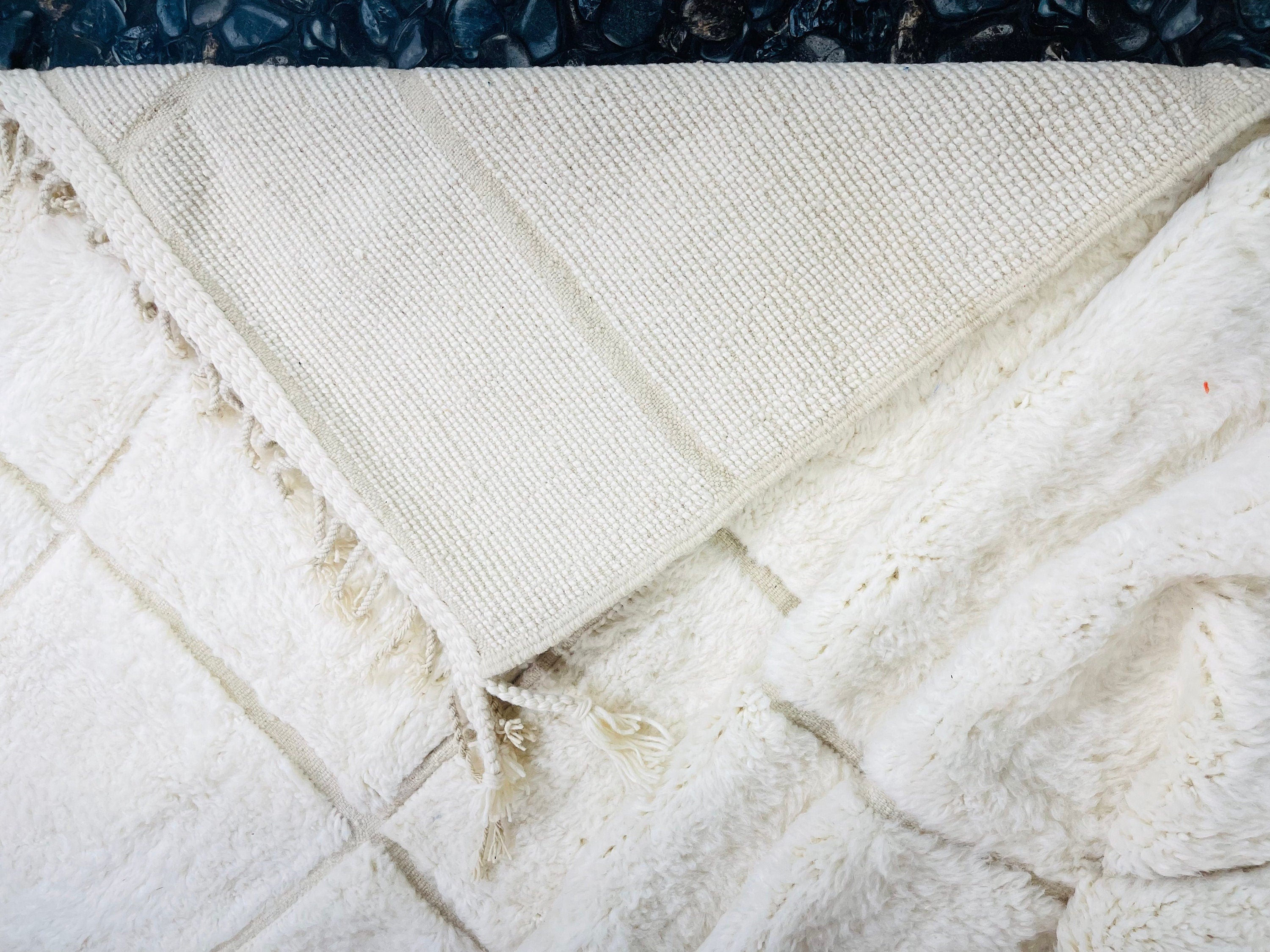 soft white blanket with textured pattern layers