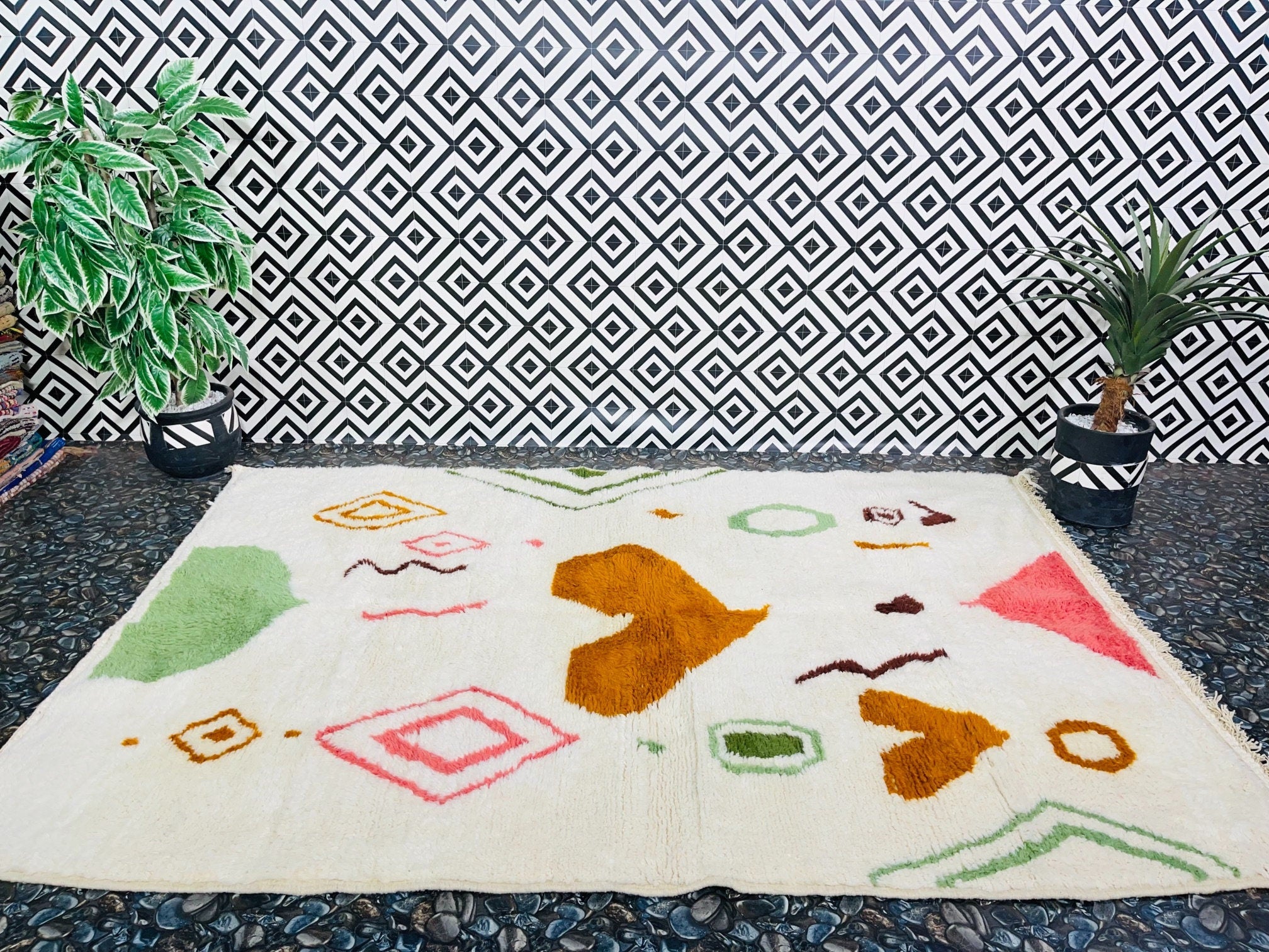 colorful rug against geometric patterned wall