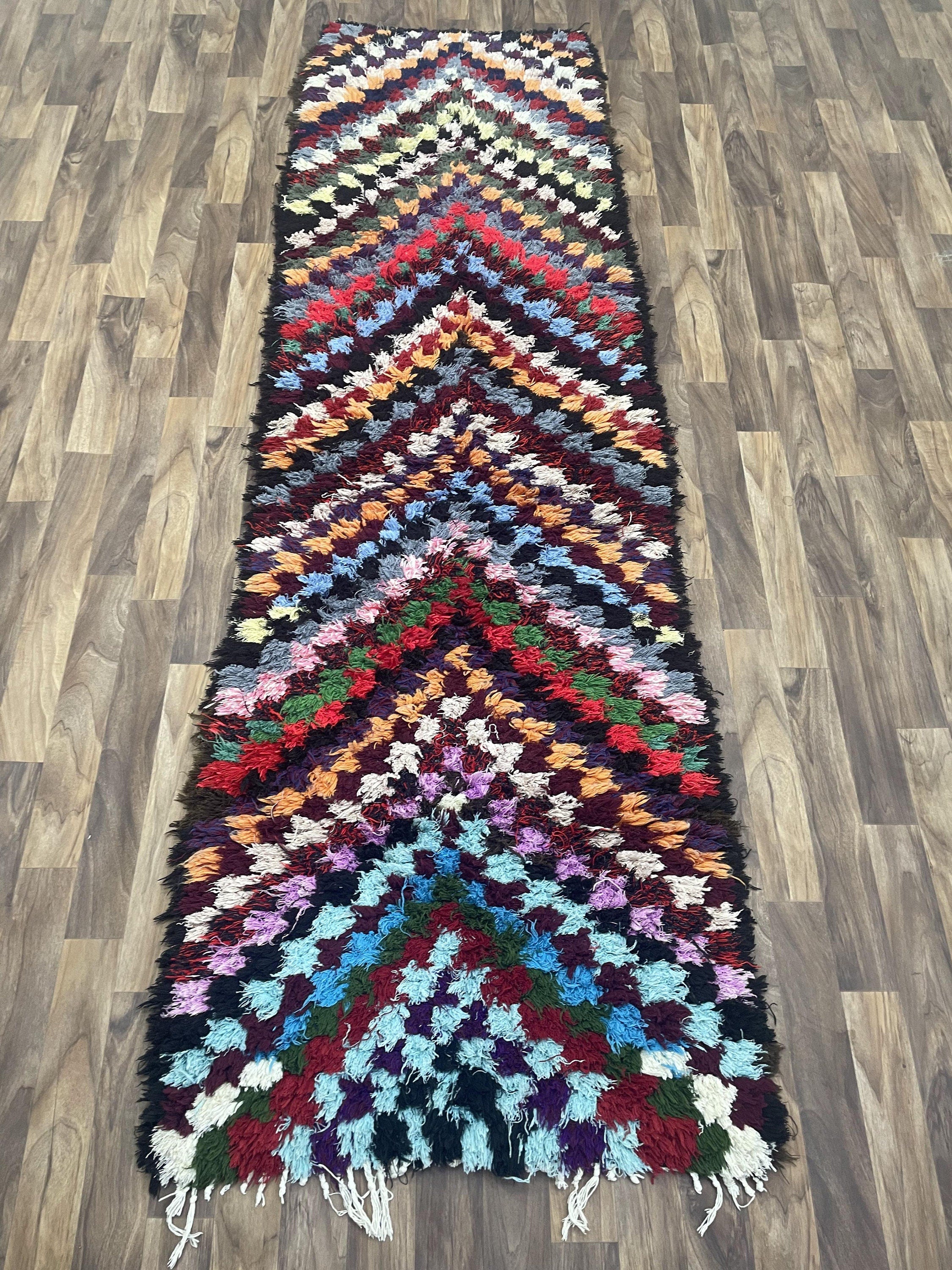 Colorful handmade rug with a chevron pattern, perfect for adding vibrancy to any space.