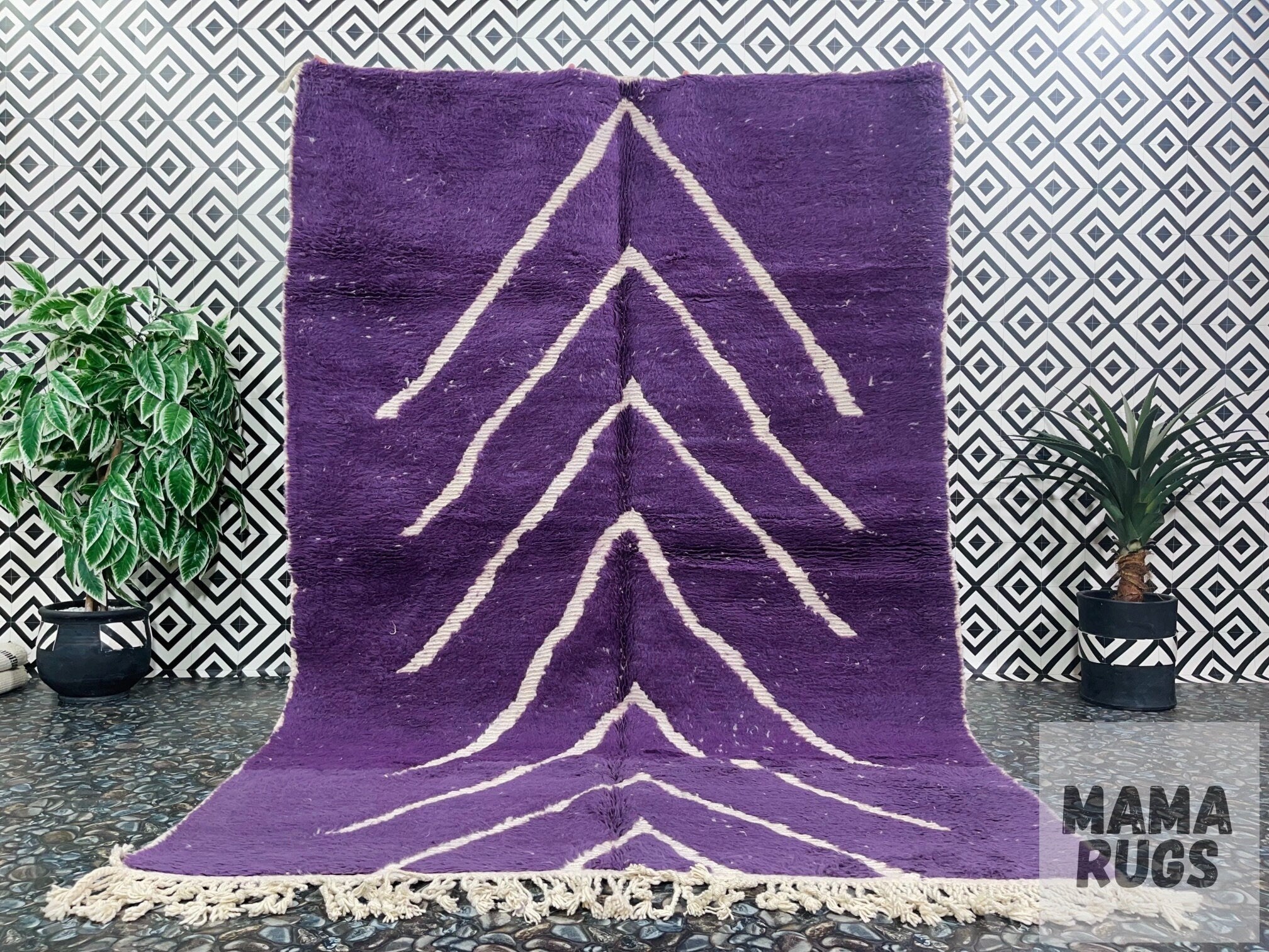 purple rug with white zigzag design indoors