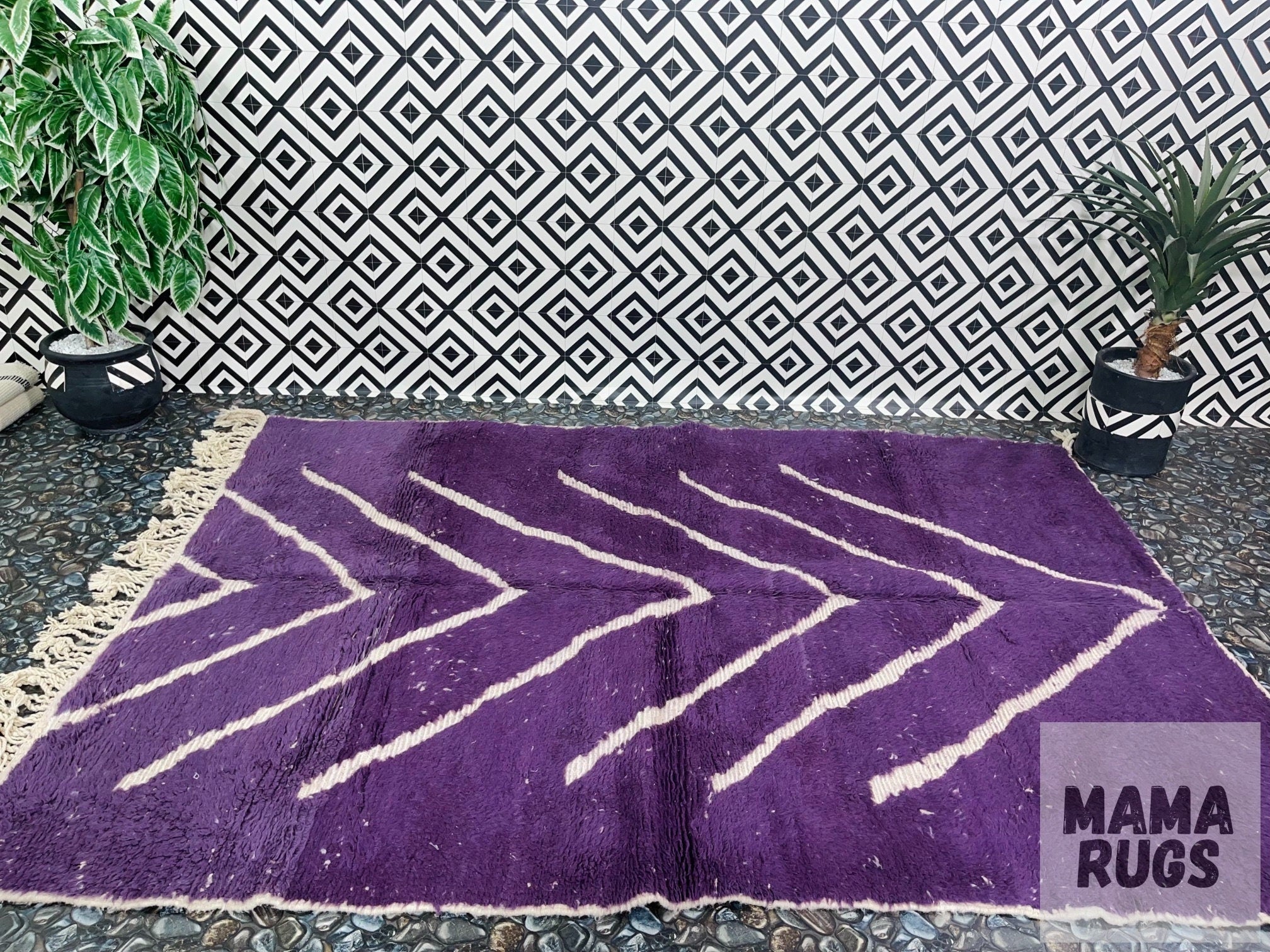 purple patterned rug on geometric background decor