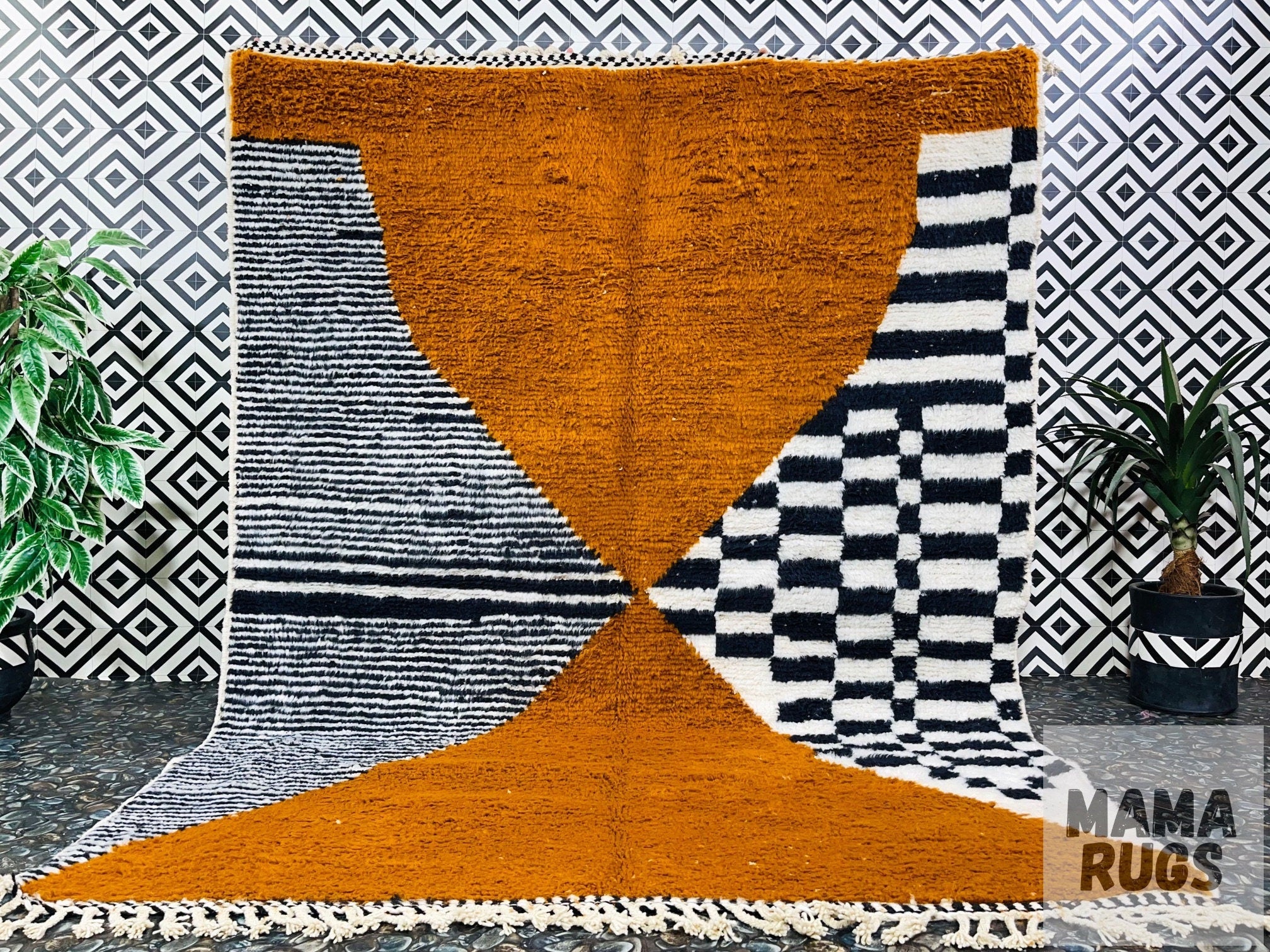 colorful geometric rug against patterned background