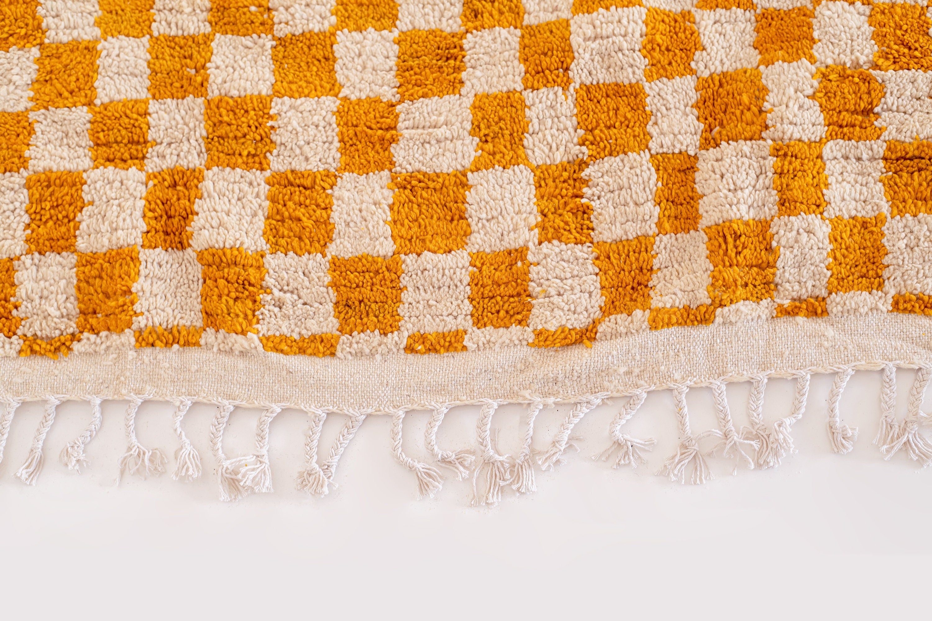 woven orange and white checkered area rug