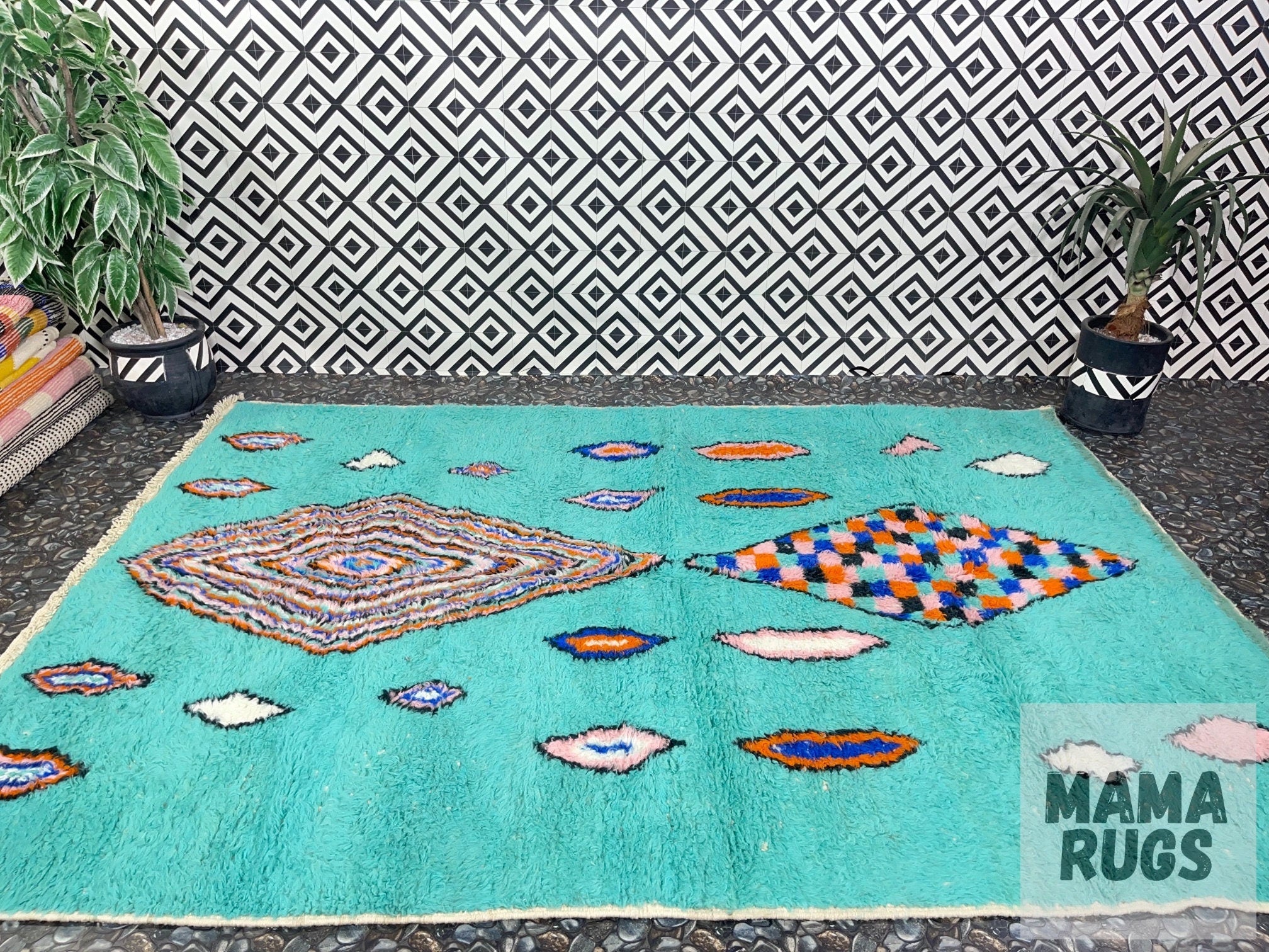 colorful patterned rug on textured background indoors