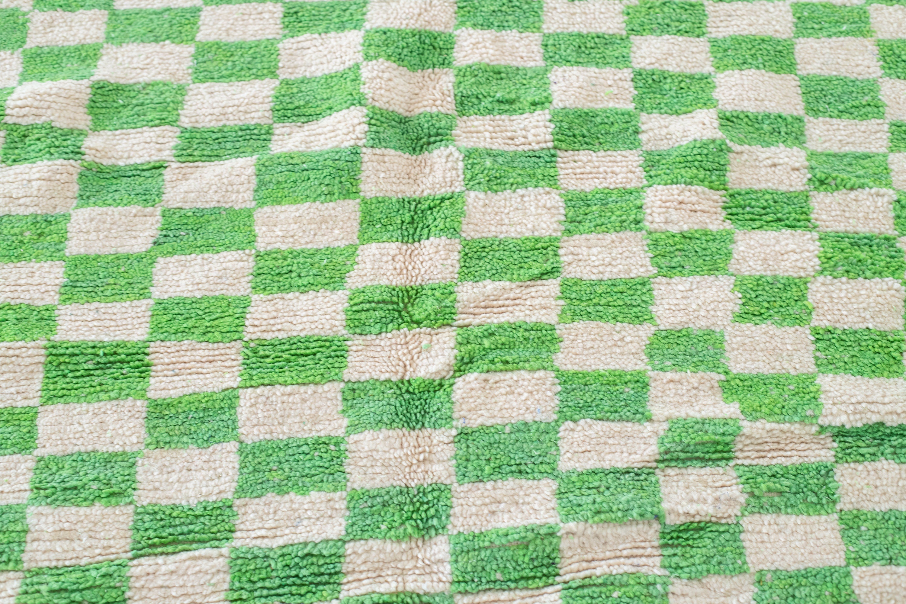 green and beige checkered fabric textile background