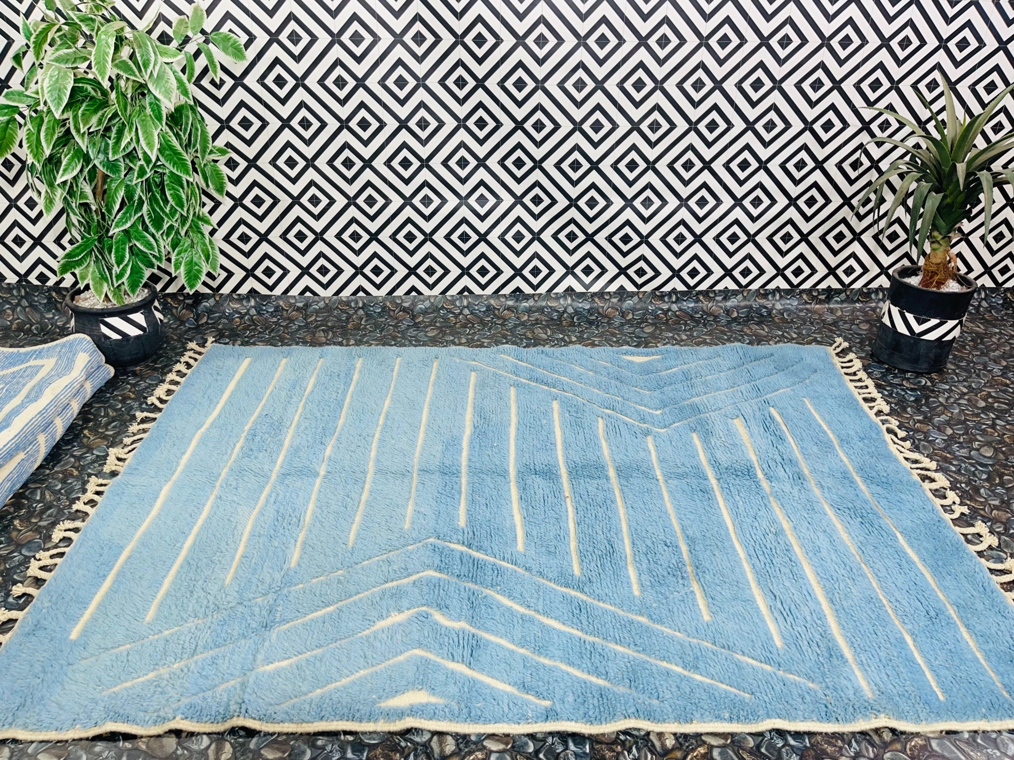 blue patterned rug with geometric design indoors