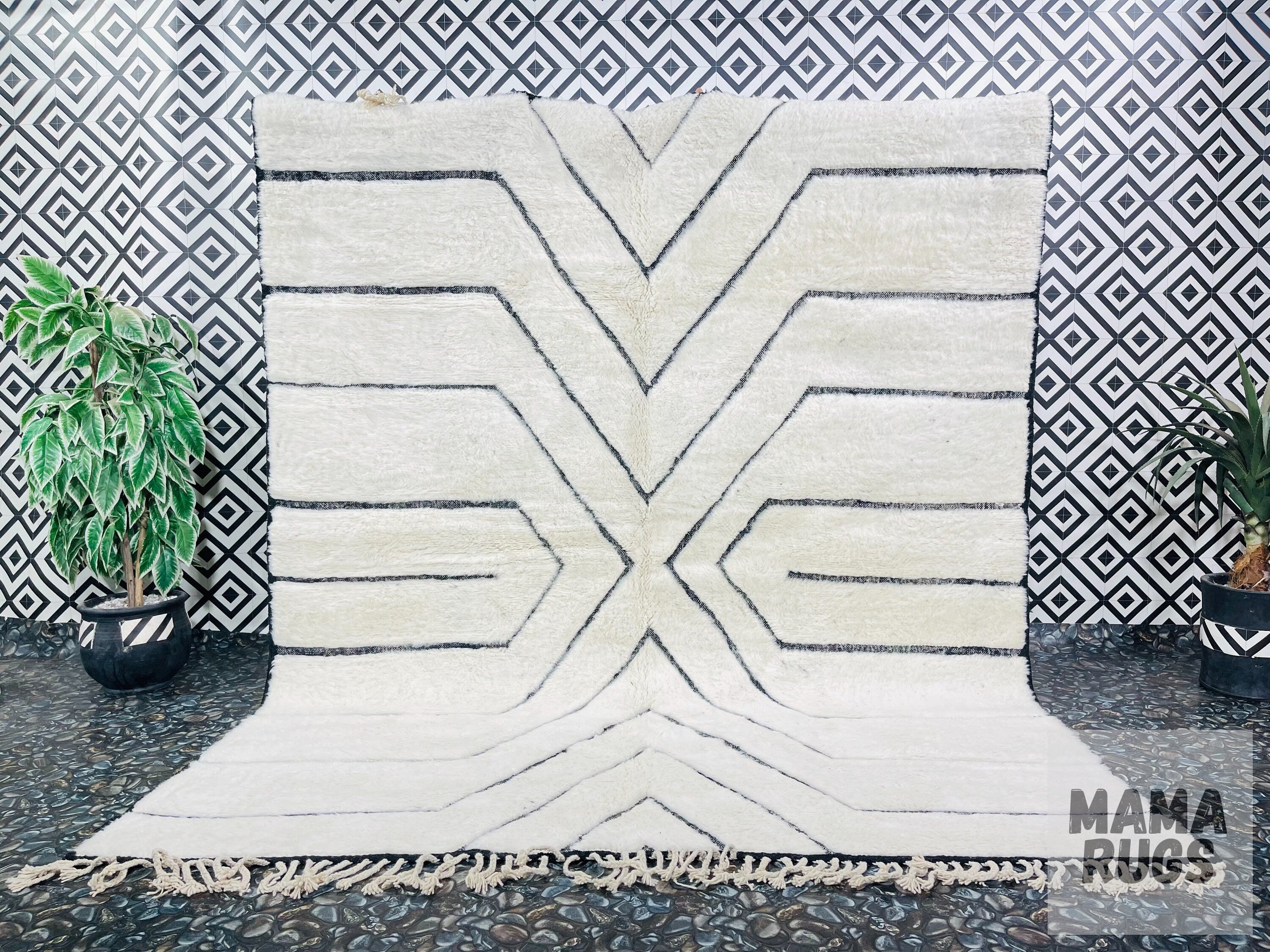 white area rug with black geometric design