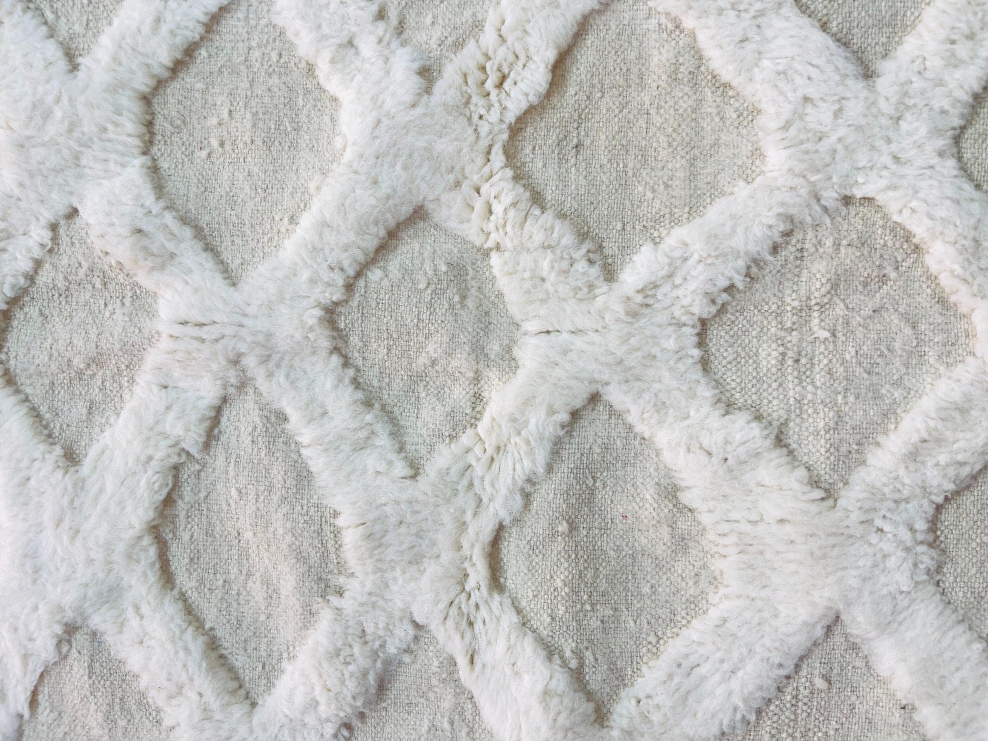 white textured fabric with diamond pattern design