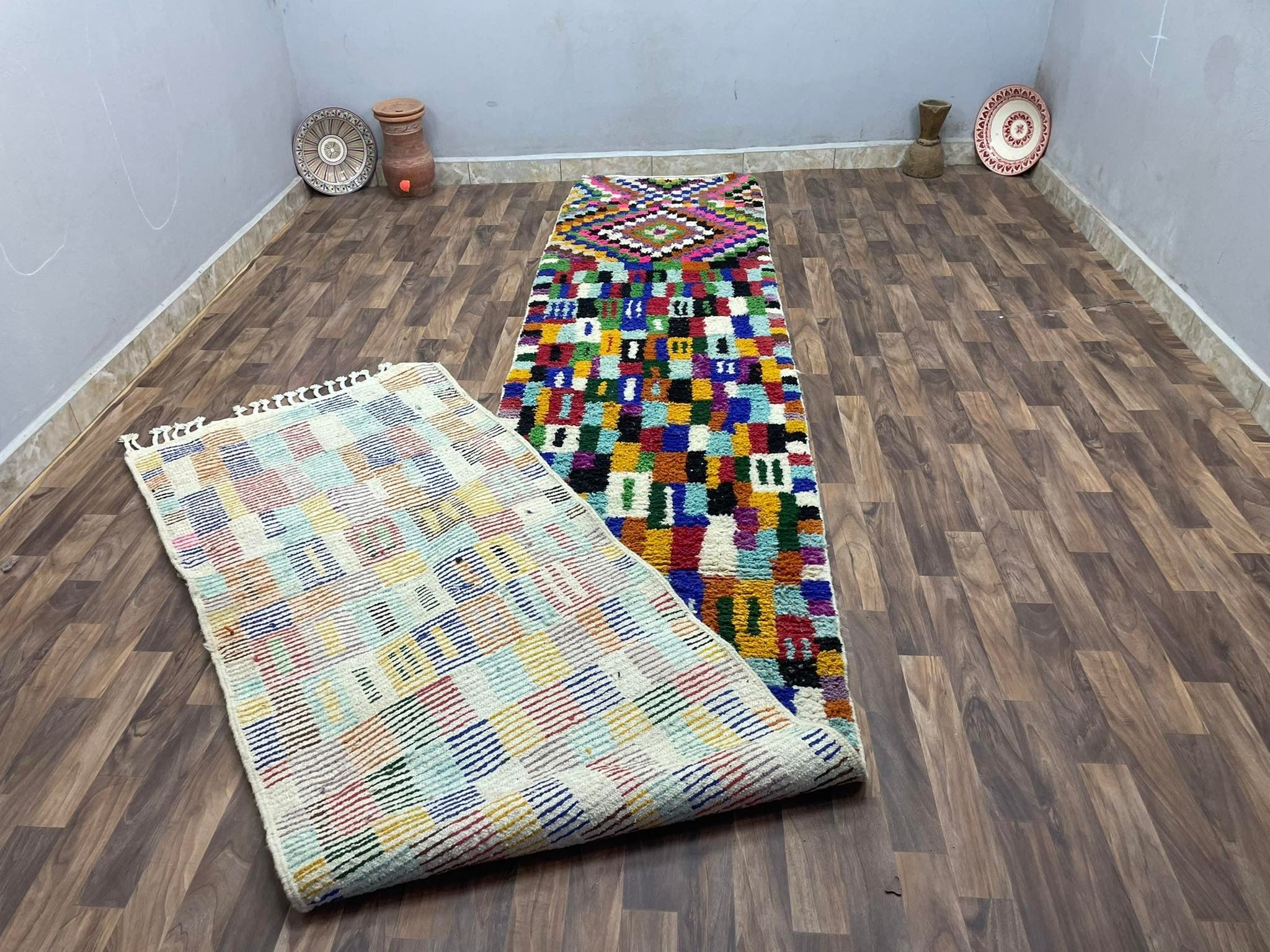 Colorful handmade rugs displayed in a cozy interior setting, perfect for home decor.