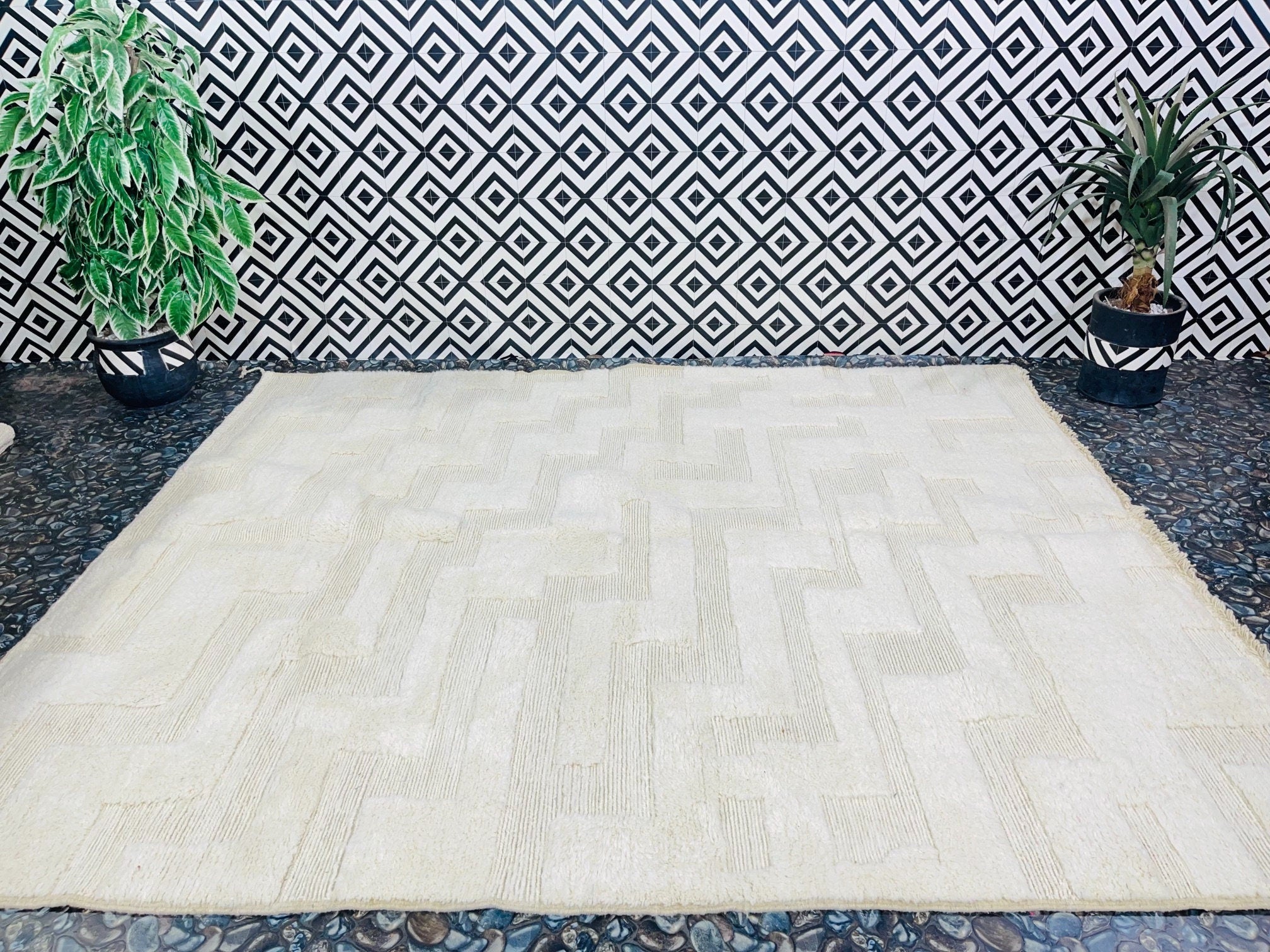 neutral carpet on patterned background with plants