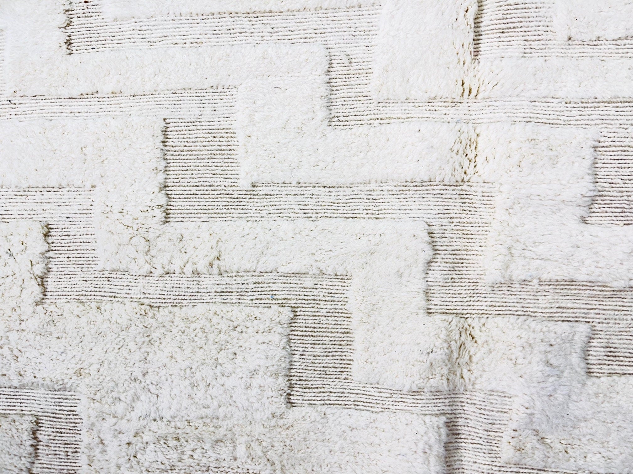 white textured fabric with geometric patterns design