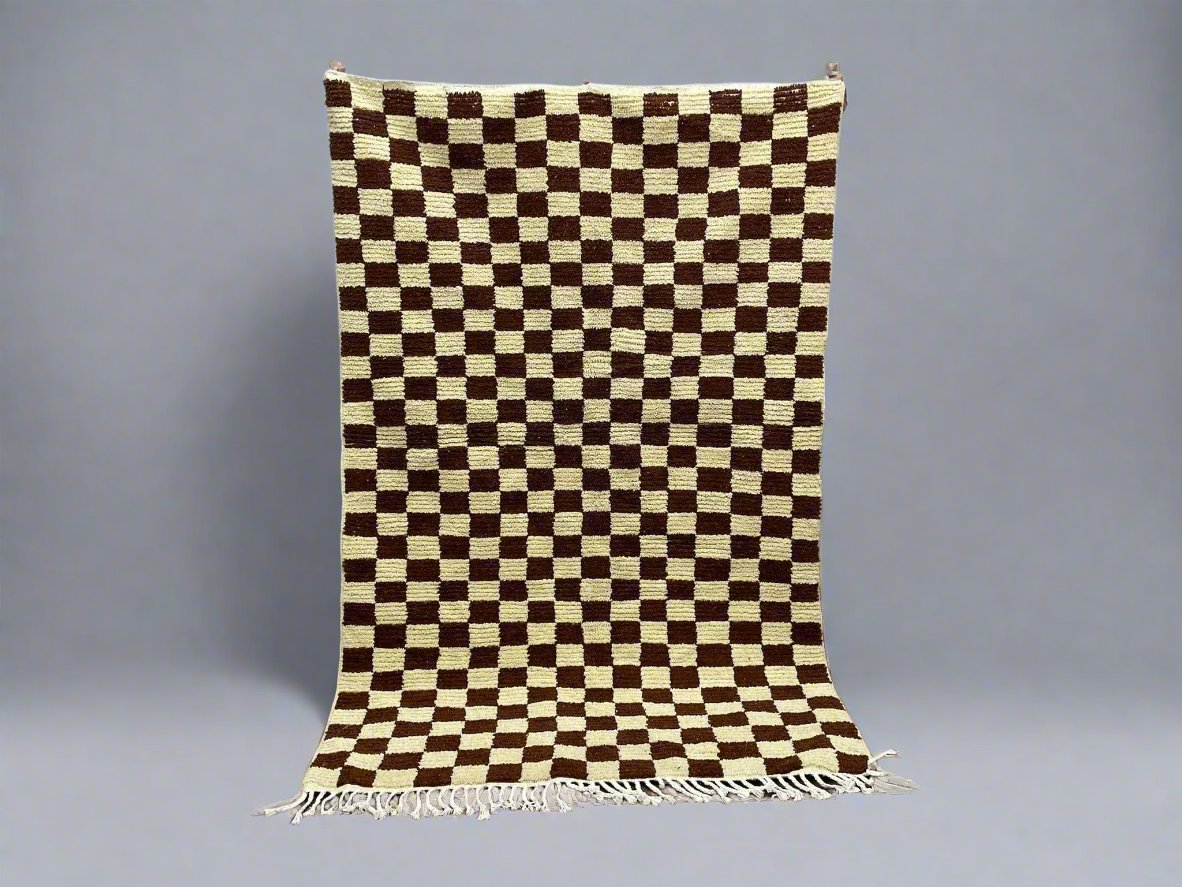 Handwoven checkered rug in brown and cream, perfect for modern home decor.