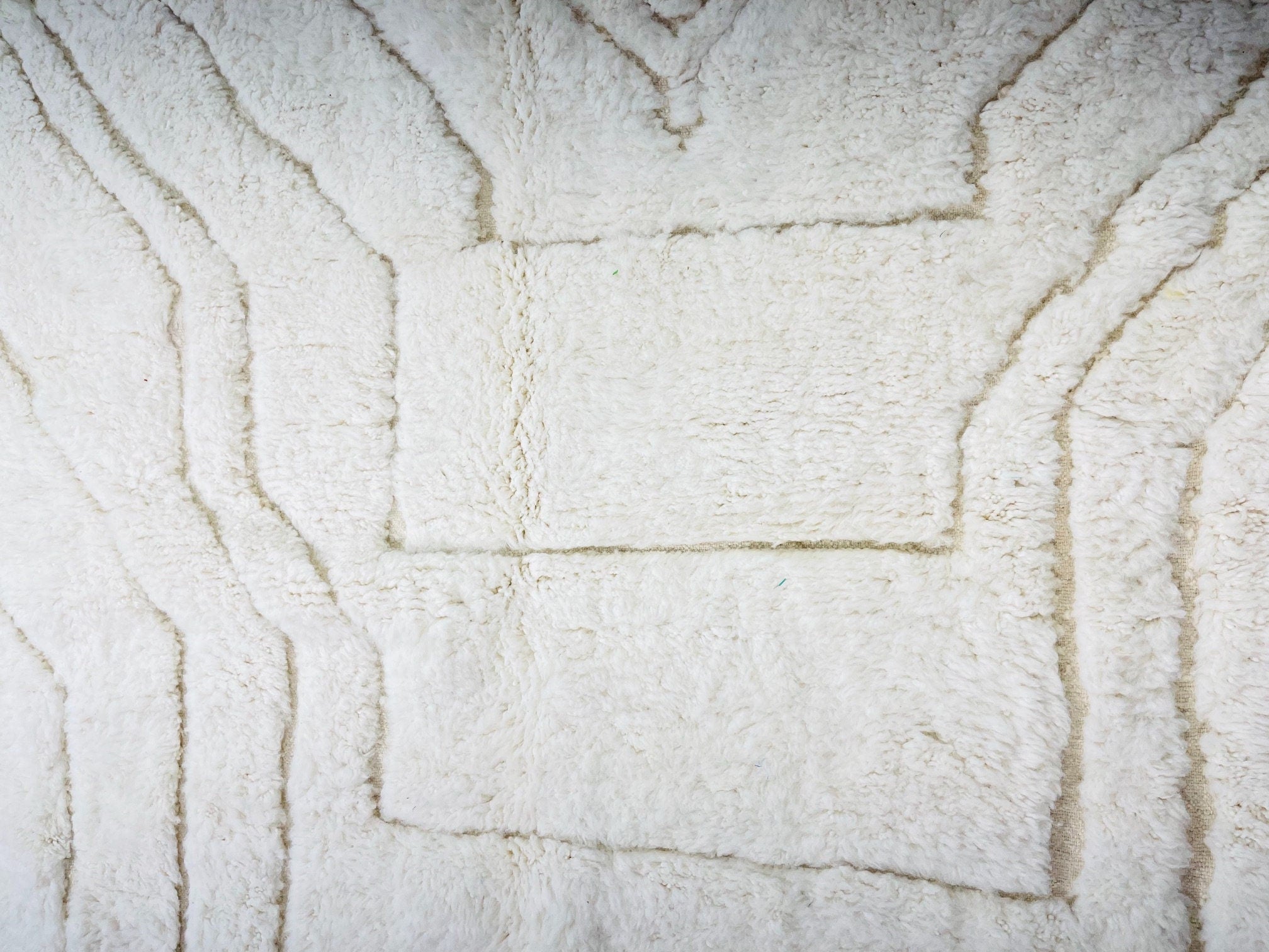 textured white plush rug with geometric patterns