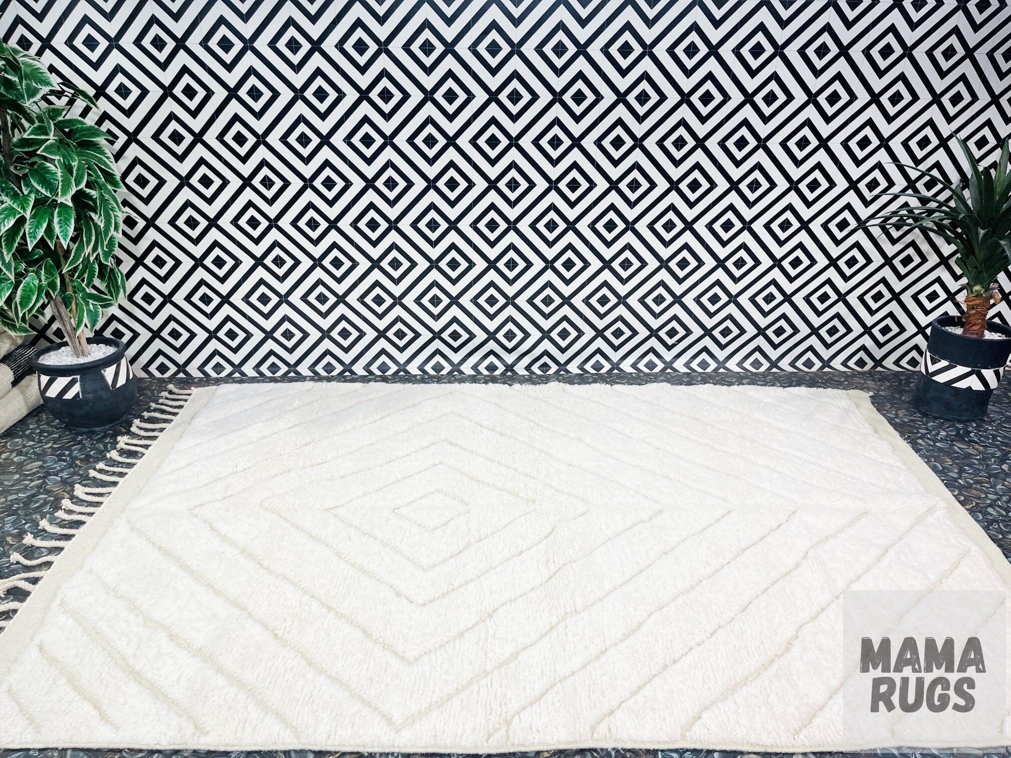 white geometric area rug on patterned floor