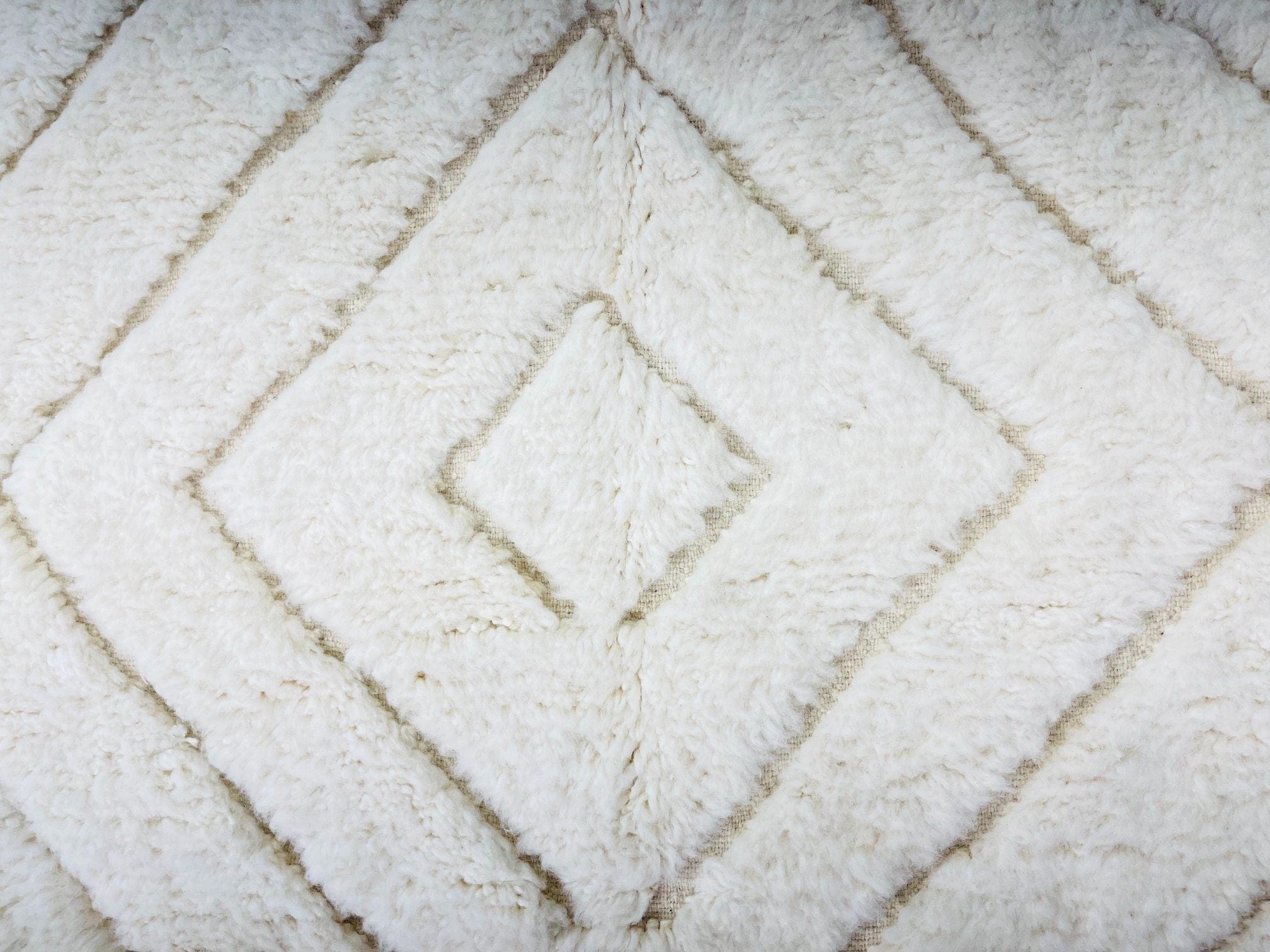 fluffy white rug with geometric diamond pattern