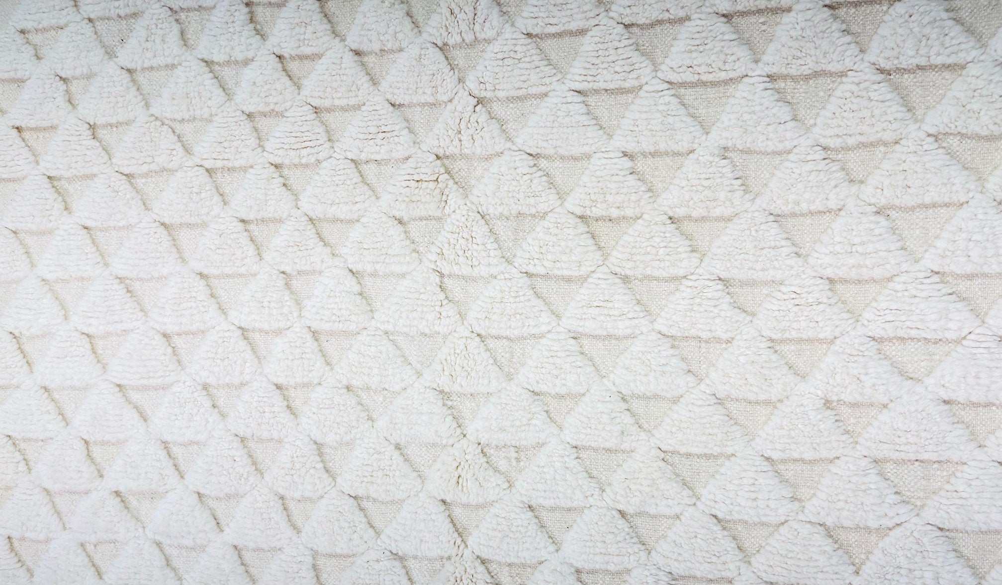 textured white fabric with triangle pattern design